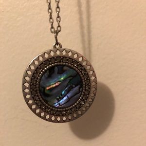 Long necklace with purple stone pendant